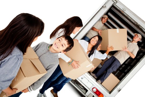 Removal van and moving team in Covent Garden street setting