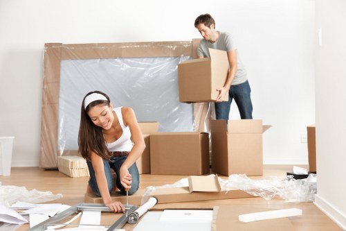 Removal team handling packed boxes during a move
