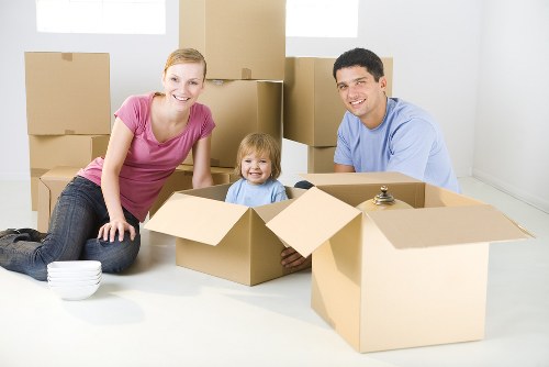 Movers carrying boxes safely during a removal job