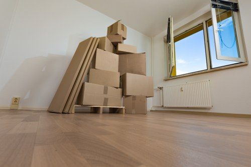 Moving van and packing boxes in central London street